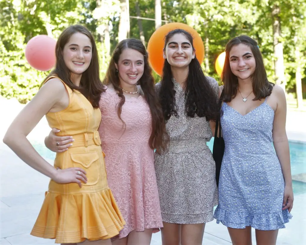 Kinkaid seniors Bradyn Robertson, Michelle Sekili, Zoe Price, and SJS senior Margaux Marinelli celebrate graduation on May 2nd, 2021. (Photo by Liz Junell)