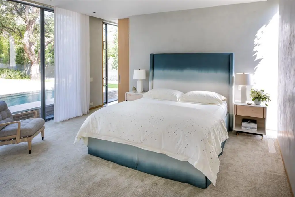 Striking views of the courtyard, pool, and garden can be found throughout the home. 