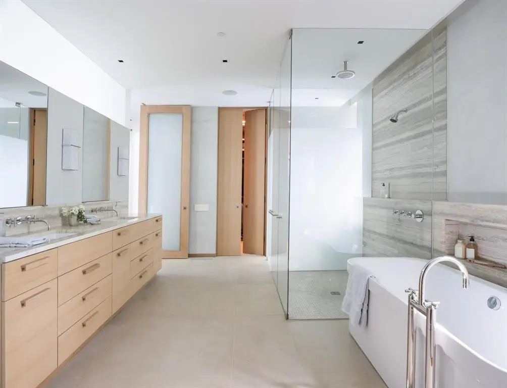 A clean-lined, spa-like master bathroom. 