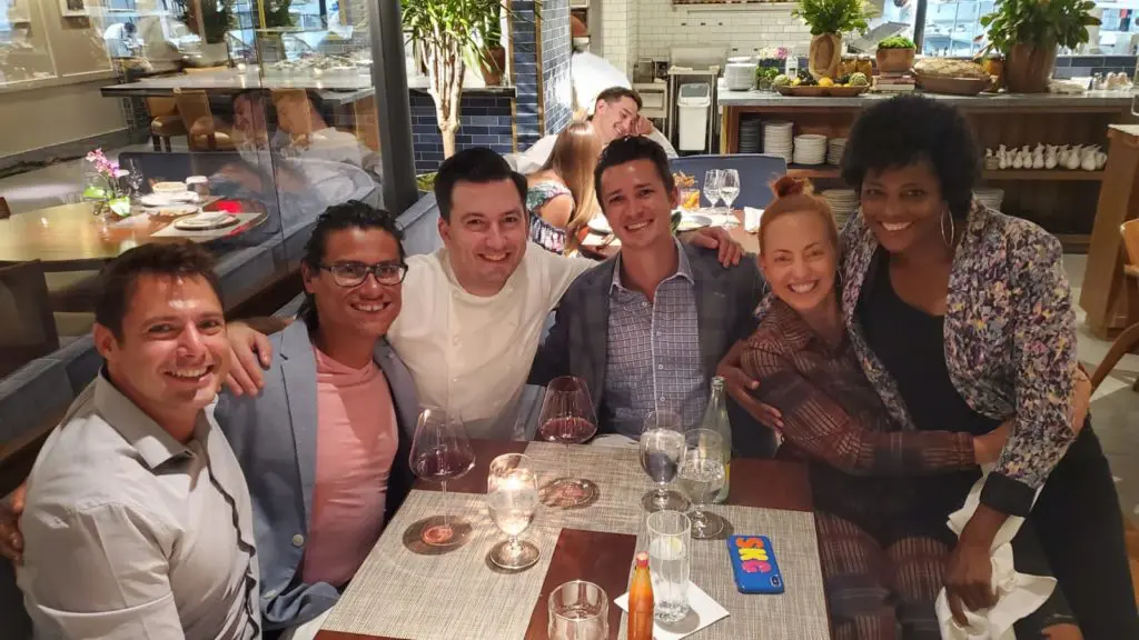 Chefs Byron Gomez, Aaron Bludorn, Sasha Grumman and Dawn Burrell and friends sharing a table at the wildly popular Bludorn restaurant.