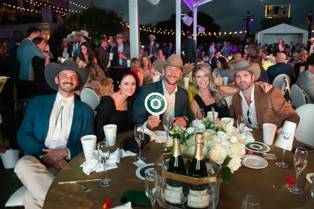 Guests at The Children's Fund event  with their paddles ready to bid on auction items – highlights included an African Safari, private jet to the Kentucky Derby and a trip to the Big Apple during the U.S. Open.

 (Photo by Wilson Parish)