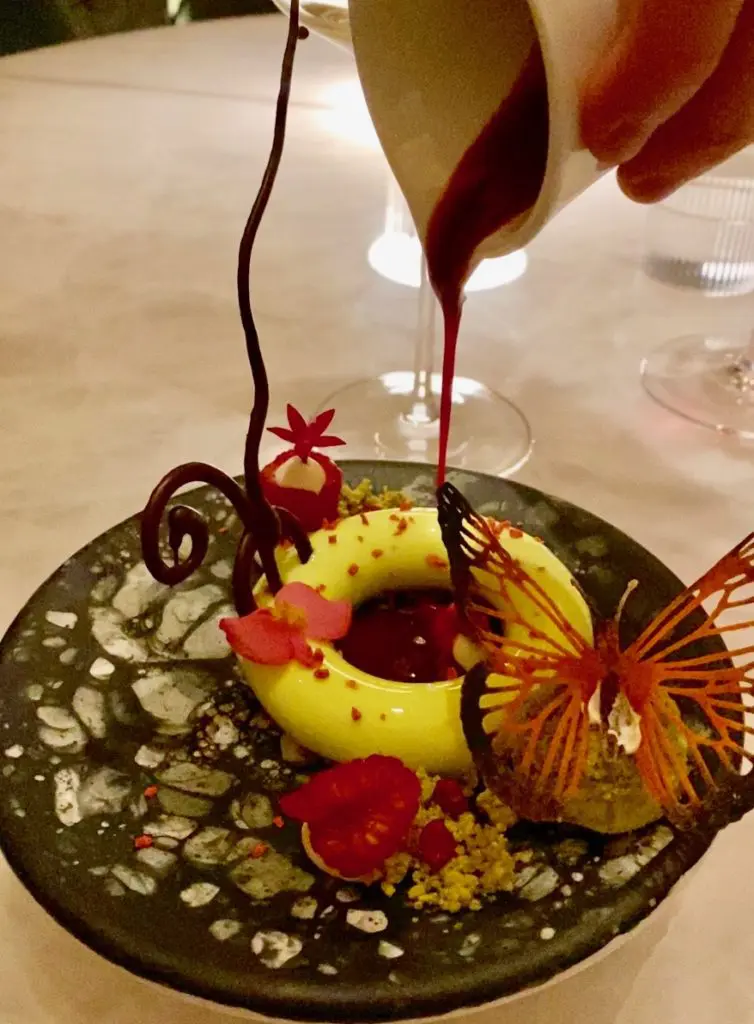 Le Jardinier Butterfly Dessert, Yuzu Delicate Mousse with Raspberry Compote and Pistachio Sablé (Photo by Shelby Hodge)