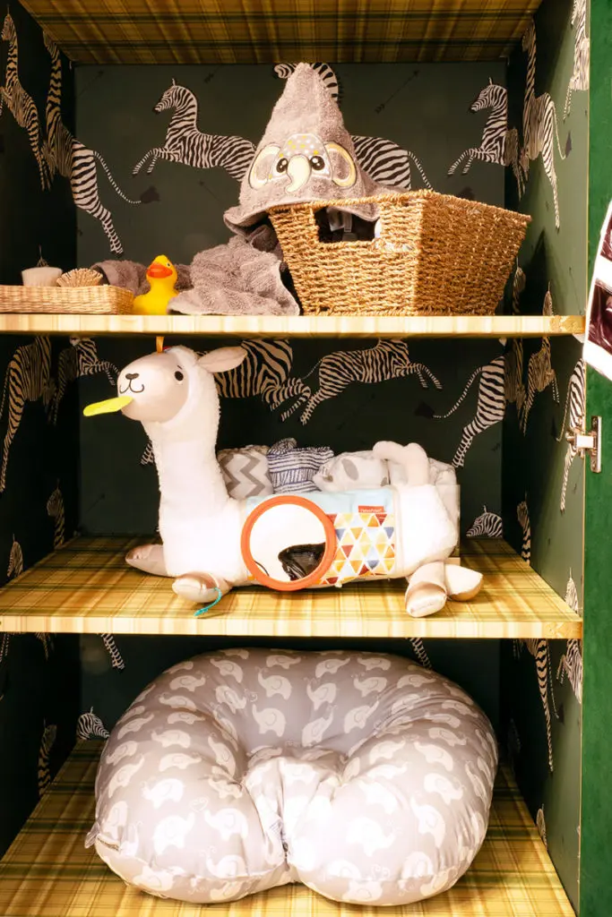 Brandon Maxwell lined the IKEA wardrobes with Thornton took his idea to the next level by wrapping the inside shelves with zebra print peel-and-stick wallpaper for his sister's nursery. (Photo by Jessy Price for Brandon Maxwell)