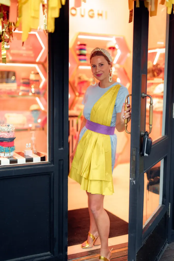 Dallas native and designer Lele Sadoughi outside her first brick-and-mortar boutique in Highland Park Village. (Photo by Bryson G Visuals)