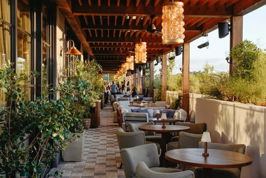 The lounge/dining area of Soho House Austin's rooftop terrace wraps around the building. (Photo by Cristina Fisher)