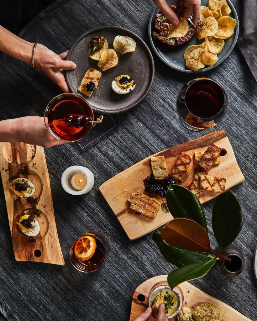 Madeline Hotel's Timber Room serves a 32-ounce Dry-Aged Bison Tomahawk, deviled eggs, and more. (Photo by Madeline Hotel & Residences, Auberge Resorts Collection)
