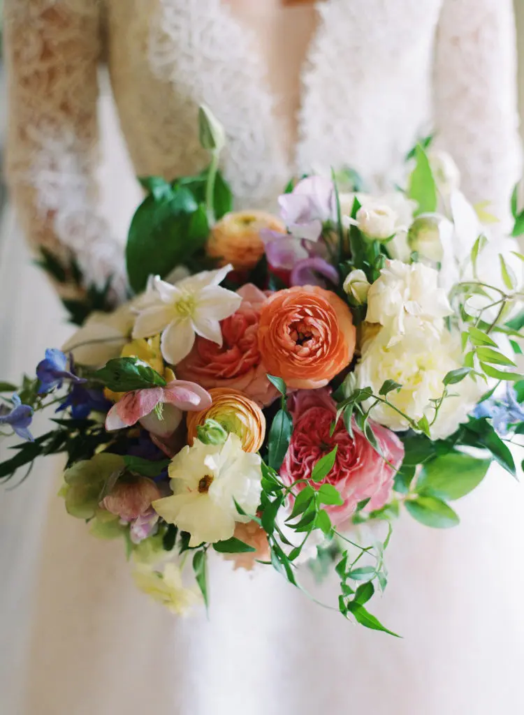 Wedding florals, including the bride's bouquet, were by Fiona’s Flowers.  (Photo by Liz Banfield)