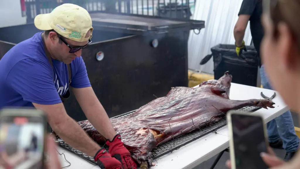 Space Cowboy executive chef Lyle Bento preps the Hawaiian style pig for roasting. (Photo by Dylan McEwan)