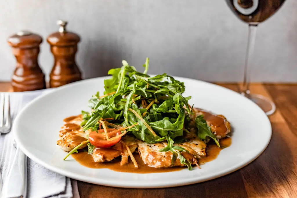 Chicken Paillard is one of several dinner offerings on the menu at NoPo Café, Market & Bar on North Post Oak, east of Spring Branch. (Photo by Kirsten Gilliam)