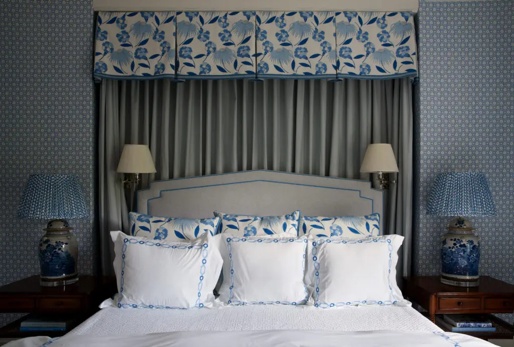 A guest-bedroom canopy is Celerie Kemble for Schumacher fabric. China Seas wallpaper. Madre lamps, Fermoie fabric shades. (Photo by Pär Bengtsson)