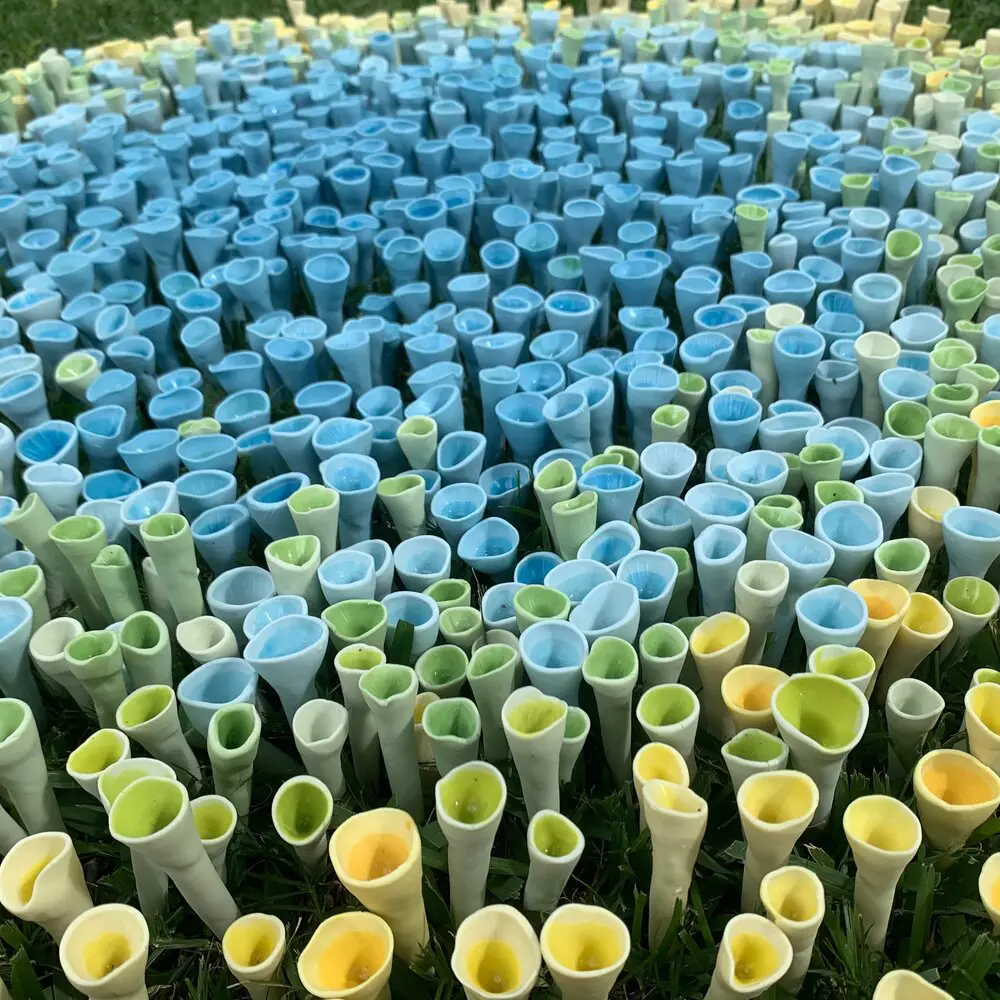 Bee Cup Oasis is a beautiful installation of Jen Rose's colorful bee cups.