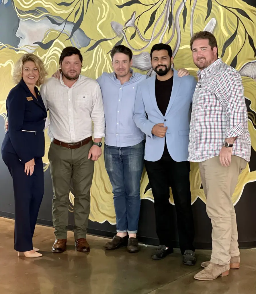 Janna Roberson, executive director of Urban Harvest; Tyler Horne, director of Farmers Market; Chef Travis McShane, chef/owner of Ostia, executive chef Mayank Istwal of Musaafer; Chef Drake Leonards, executive chef-partner of Eunice at the Urban Harvest lunch announcing the chef line-up for the annual Sunday Supper. (Photo by Lisa Gochman)