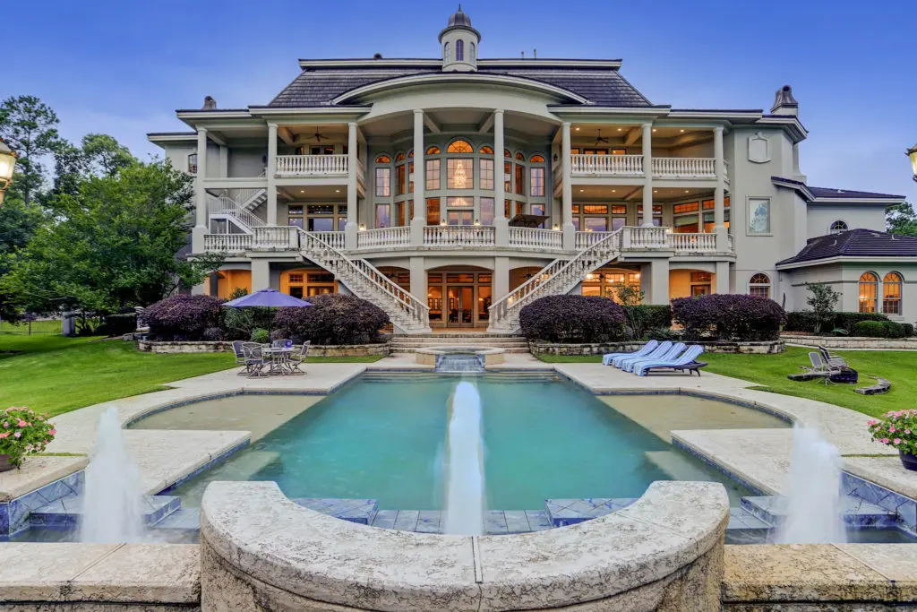 Three terraces offer views of the pool and the surrounding manicured acreage at 8 Deer Ridge Estates Boulevard. (Photo by TK Images)