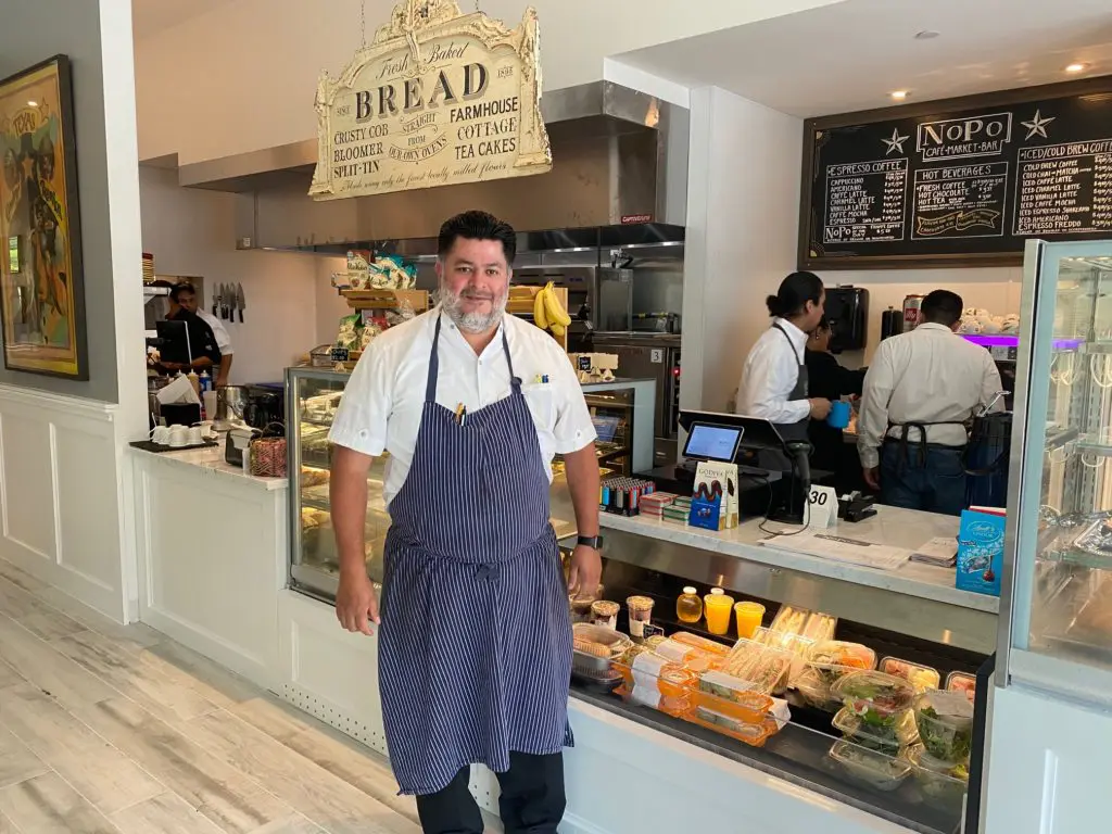 Berg Hospitality culinary director Jose Hernandez in the grab-and-go market counter at NoPo Café, Market & Bar. (Photo by Shelby Hodge)