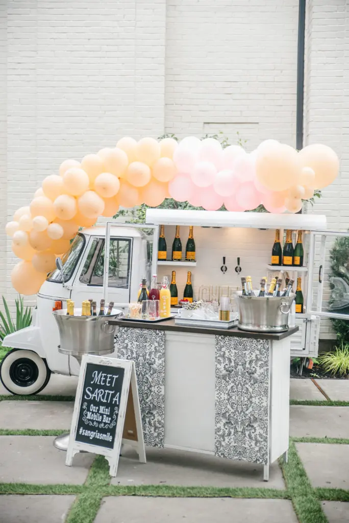 Jo's Mobile Mini Bar pours the bubbly for Nancy Almodovar's birthday event. (Photo by BanAvenue Photography)
