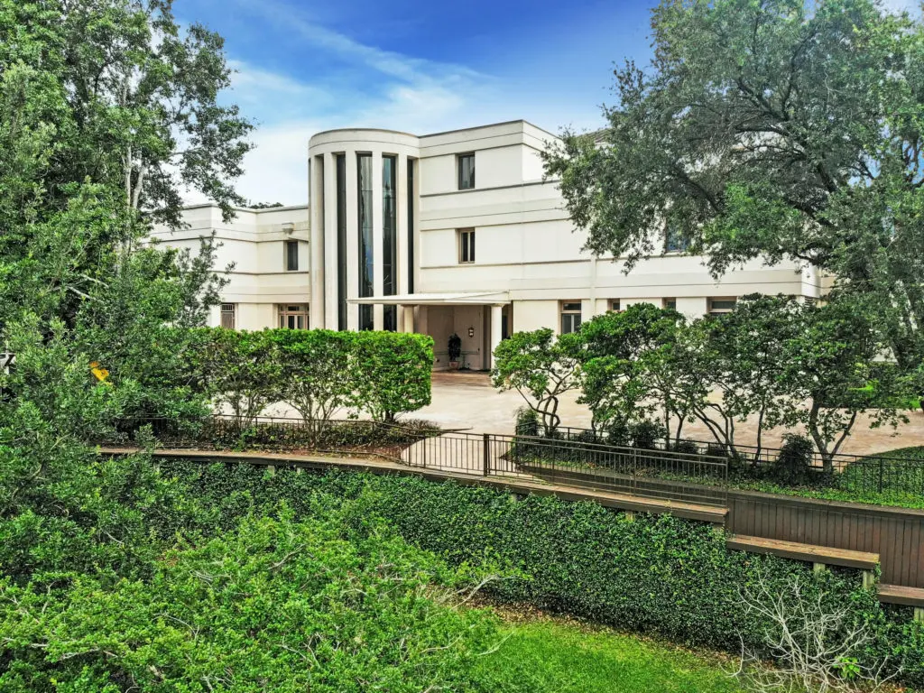  The uniformed windows provide sleek, clean lines while the magnificent bow window and lush landscaping offer elements of softness that perfectly complement one another.  (Photo by TK Images)