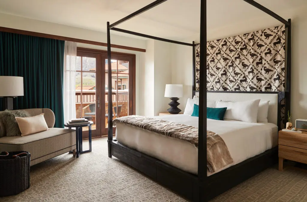 A guest room with a king bedroom and an enviable balcony.  (Photo by Madeline Hotel & Residences, Auberge Resorts Collection)