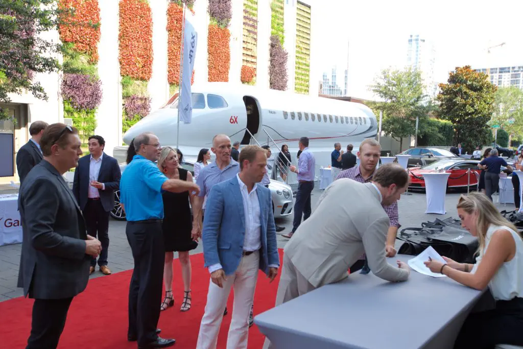 A select group of high-rollers cruise the mock-up of the Dassault Falcon 6X during an unveiling of the 'ultra wide body' private jet at the Post Oak Hotel. (Photo by John Manigold)