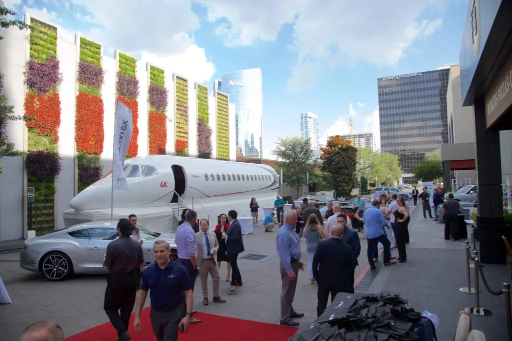 A select group of high-rollers cruise the mock-up of the Dassault Falcon 6X during an unveiling of the 'ultra wide body' private jet at the Post Oak Hotel. (Photo by John Manigold)