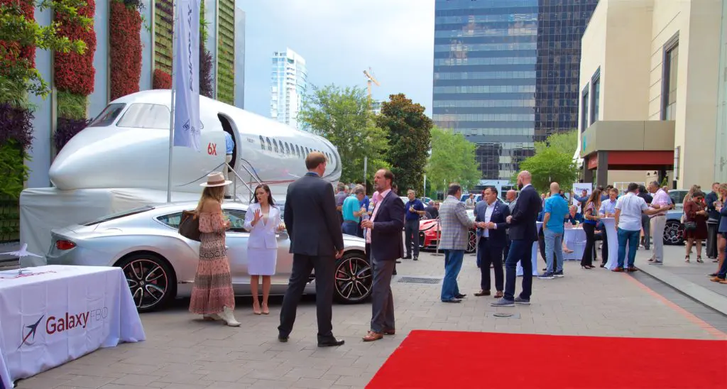 A select group of high-rollers cruise the mock-up of the Dassault Falcon 6X during an unveiling of the 'ultra wide body' private jet at the Post Oak Hotel. (Photo by John Manigold)