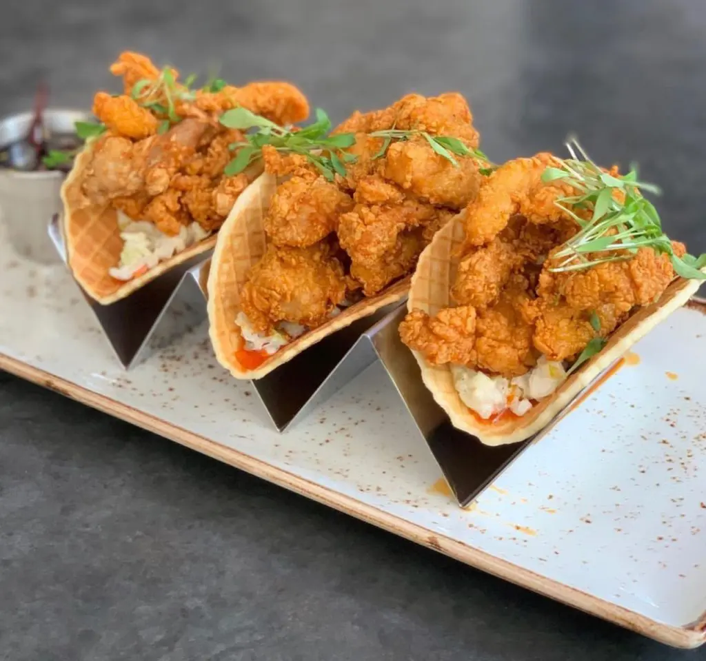 Typically a happy hour special, State Fare Kitchen & Bar will offer HTown Hot Chicken & Waffles all day on July 6. (Lisa Gochman photo)