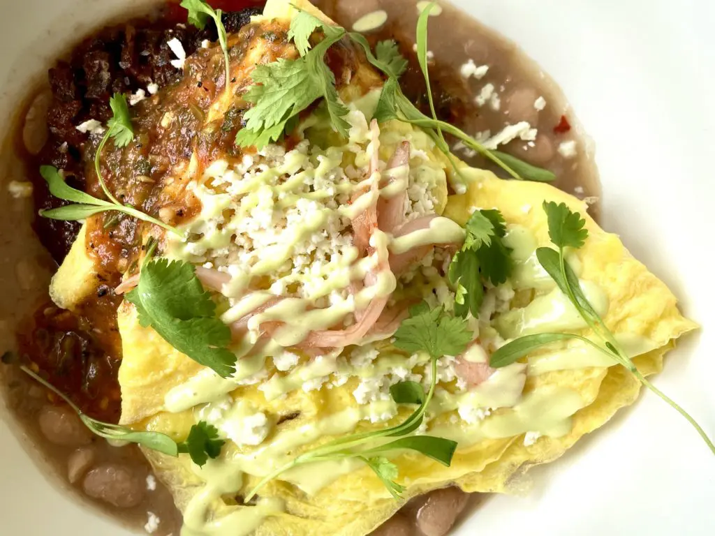 Migas is served layered with a folded omeltte. (Photo by Courtney Dabney).