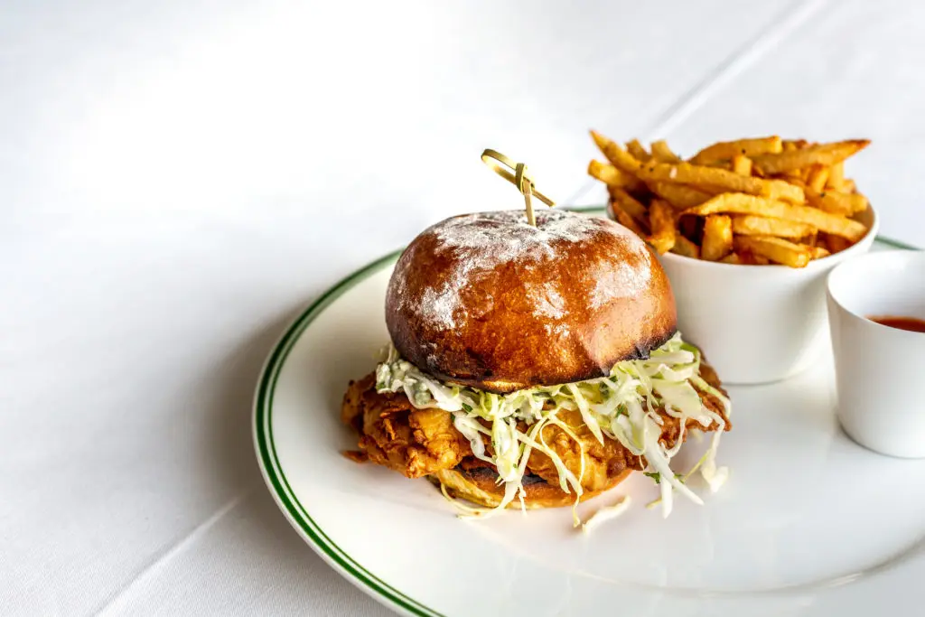 The Annie’s Fried Chicken Sandwich, served with blue cheese slaw and French fries, is available daily on the lunch menu. (Photo by Jenn Duncan)
