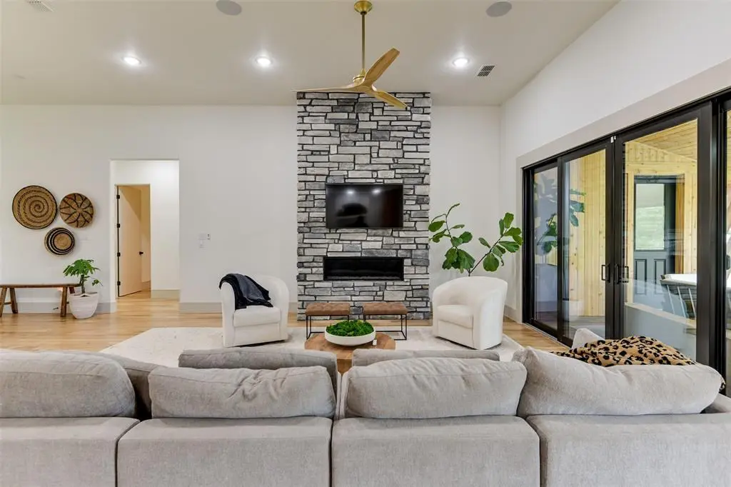 Slick glass doors blend outdoor and indoor living areas beautifully. 