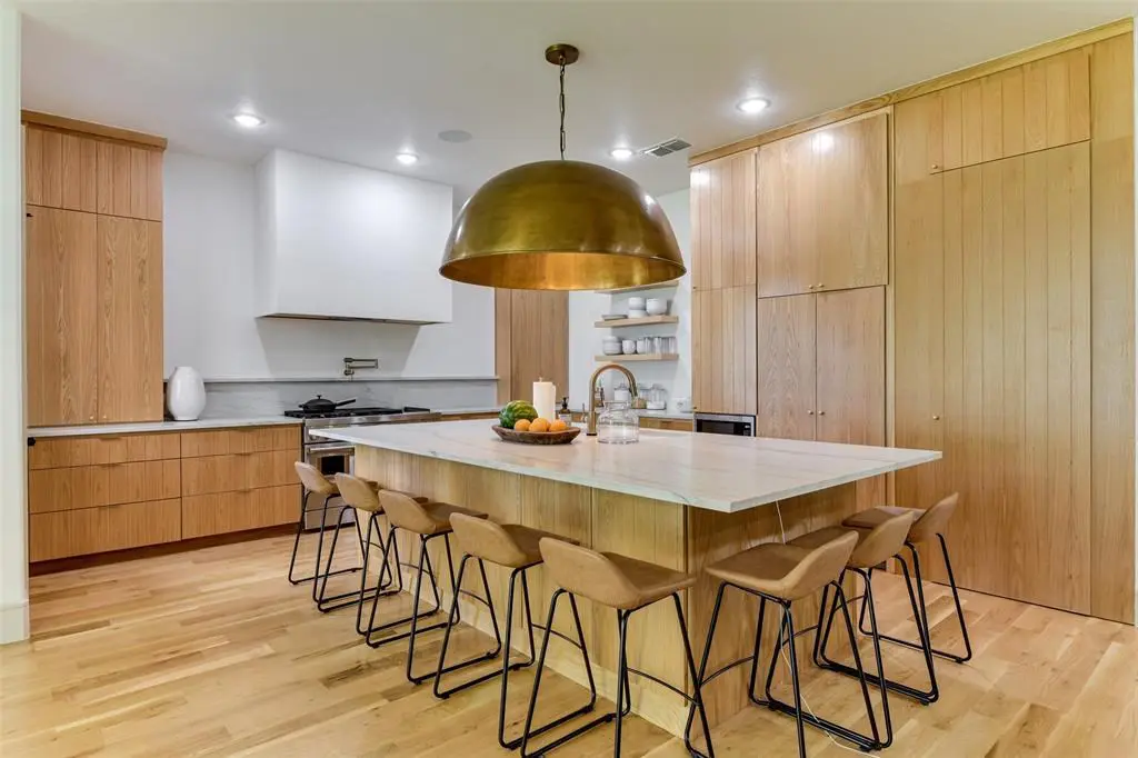 The striking kitchen serves as the heart of the home. 