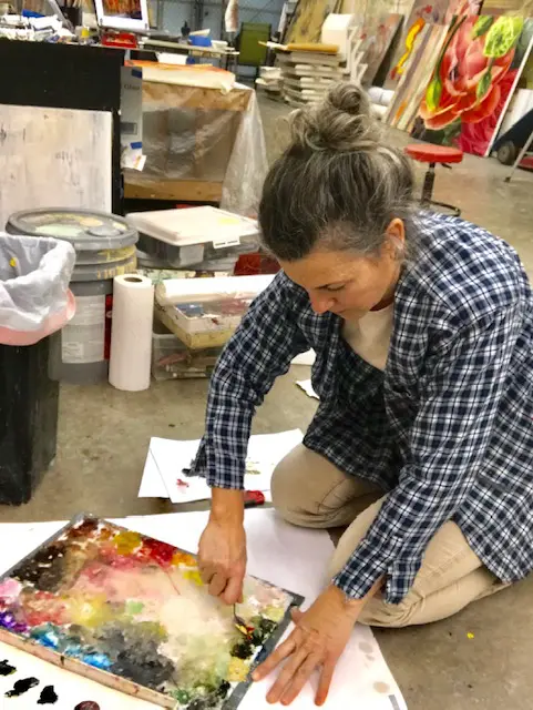 Dallas artist Marlowe Monfort Hermanovski adds finishing touches to a watercolor. Her painterly work will be seen in Martin Scorsese's film, "Killers of The Flower Moon.
