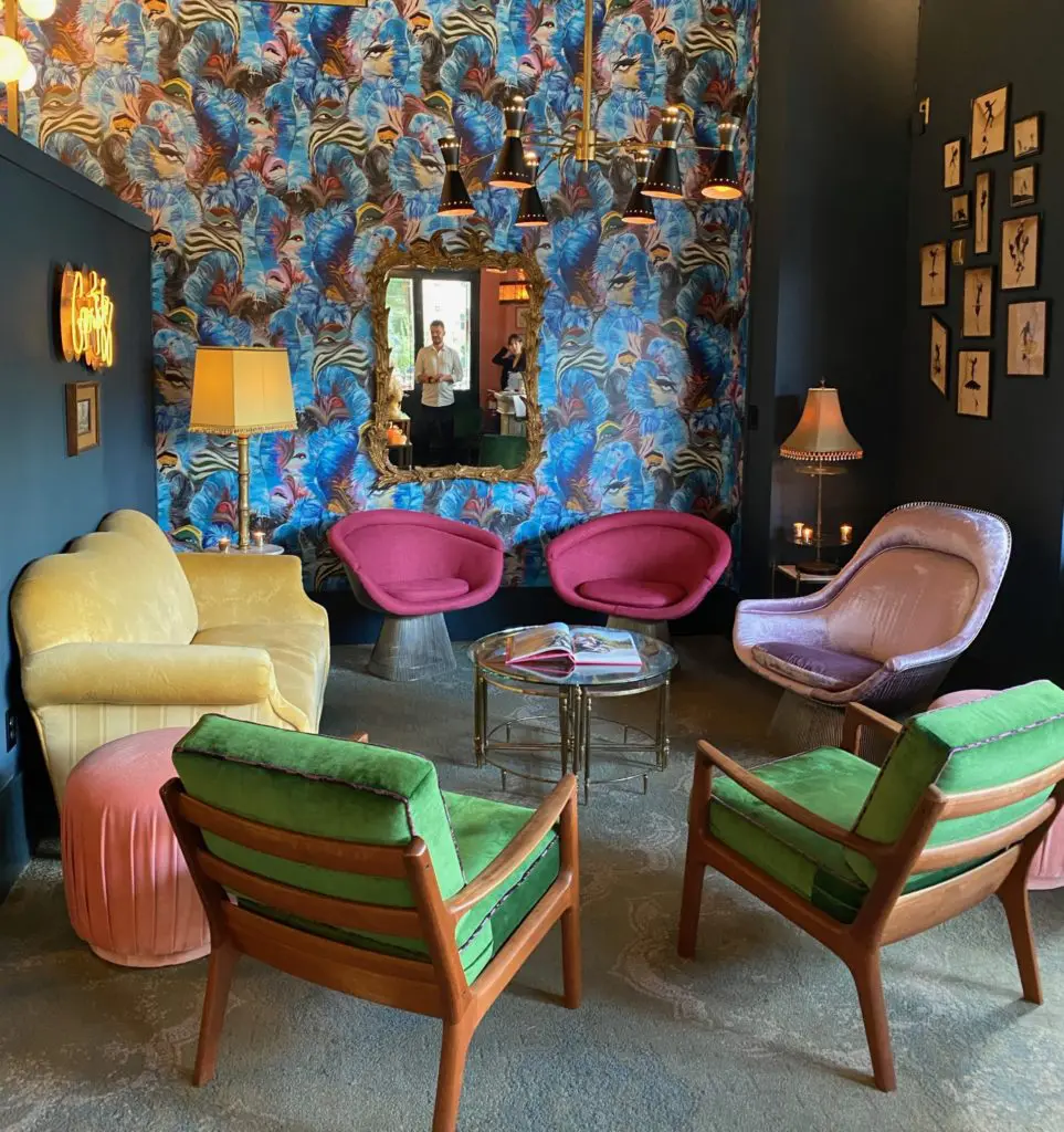 The petite lounge at Gratify, features a loveseat from former Lt. Gov. David Dewhurst's office in Austin, one of several quirky elements in the bistro.
