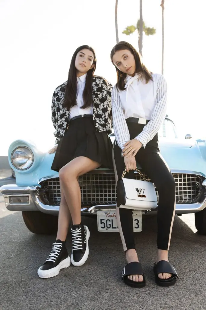 Social media rock stars Emma Chamberlin and Charli' D'Amelio team up for a Louis Vuitton campaign shoot introducing LV Squad sneakers and LV Sunset mules. (Photo courtesy of Louis Vuitton)