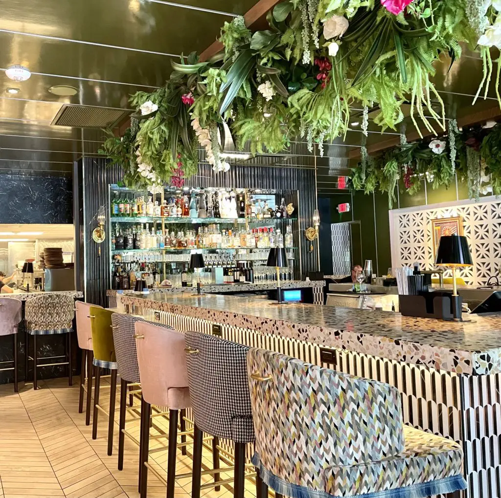 Geometric and florals explode at the horseshoe shaped bar. Photo by Courtney Dabney.