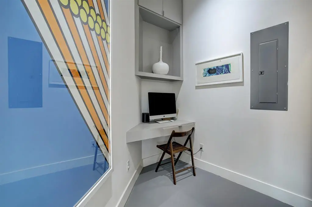 Every inch of the Triangle House in The Heights is utilized as seen in this corner computer perch.