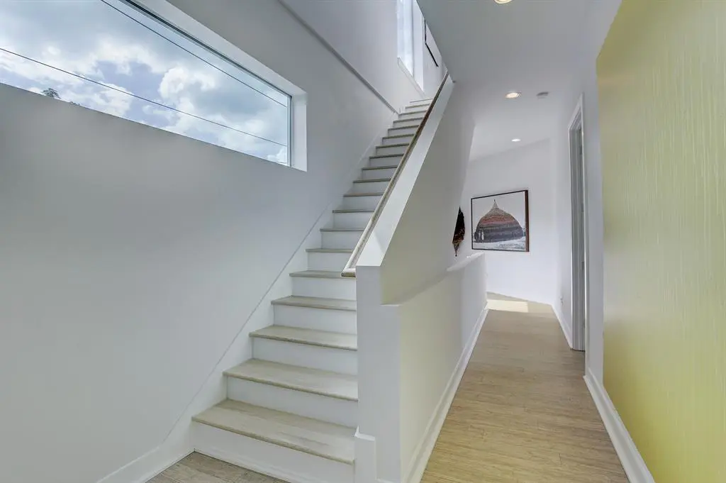 Stairway to the third floor of the Triangle House in The Heights.