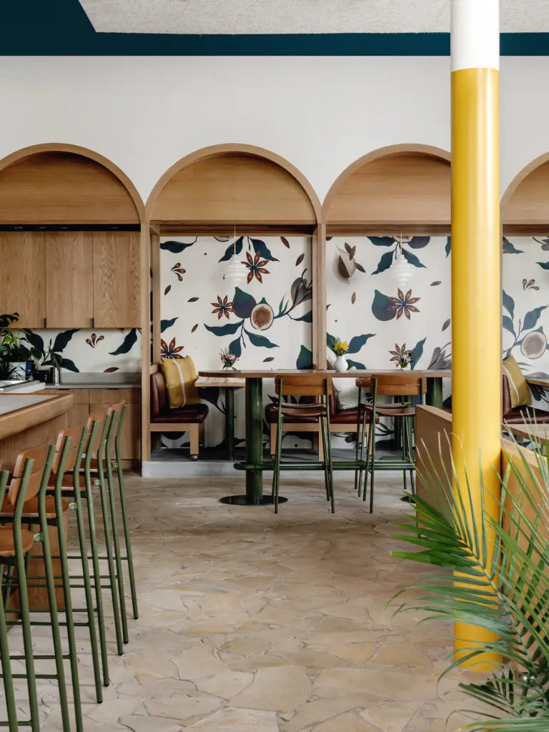 Playful fig wallpaper establishes a casual feel in the dining room of da Gama Canteen. (Photo by Chase Daniel)