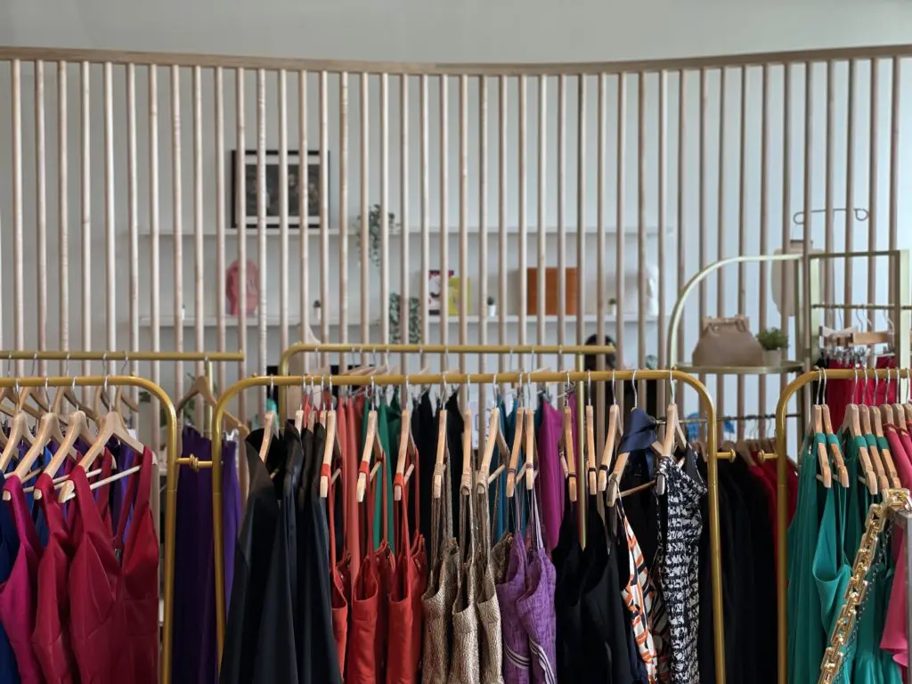 The new boutique allows customers to see into the sewing room while they shop.