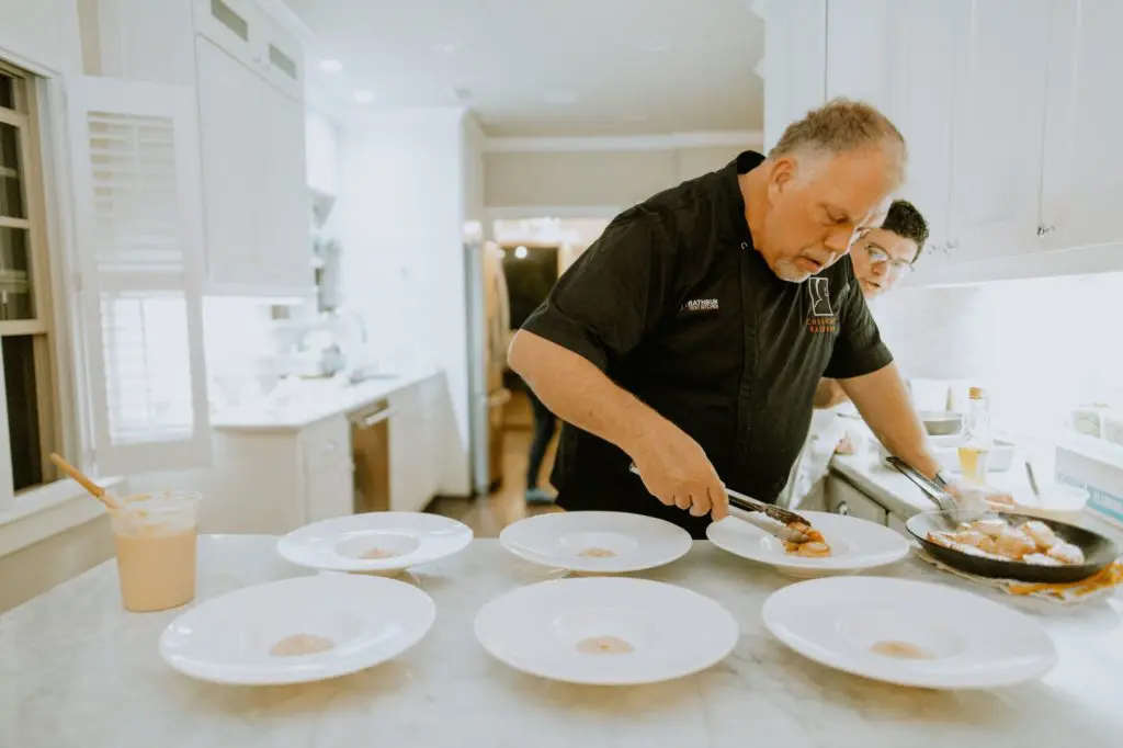 Chef Kent Rathbun plates a four course meal for one very special 35th birthday. Brenden Williams Photography. Event design by Social Llama Events.