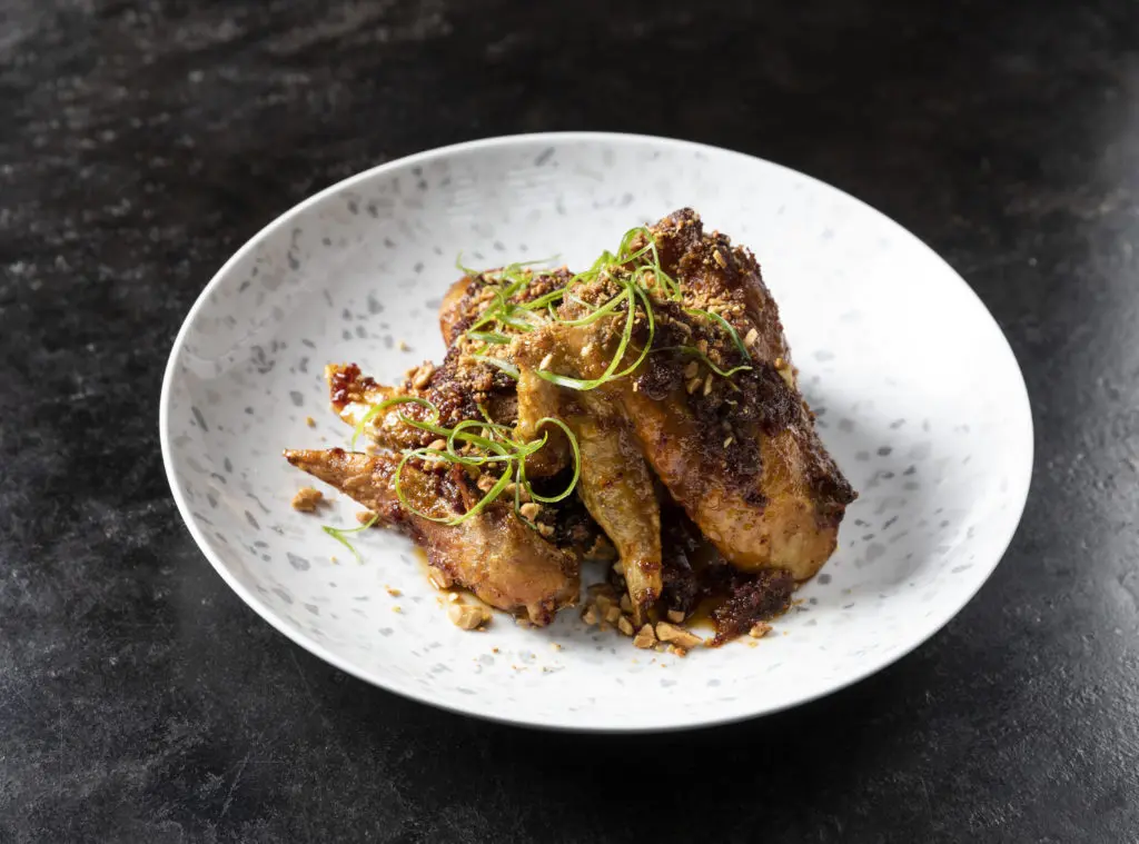 Georgia James Tavern's Viet-Cajun confit chicken wings (Photo by Julie Soefer)