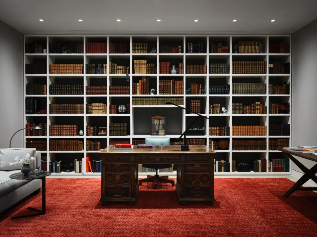 In the study, custom Marc Phillips rug. The antique desk belonged to the homeowner's father. Poliform side table, vintage Cedric Hartman floor lamp and Tizio task lamp. (Photo by Douglas Friedman)
