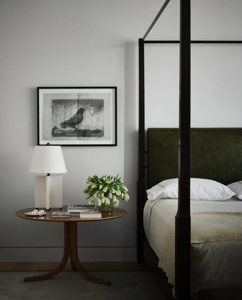 In the main bedroom, 1940 table by Josef Frank. Lamp by Mattaliano. William Kentridge's "Bird with Mirror" on paper. (Photo by Douglas Friedman)