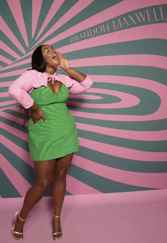 Brandon Maxwell swirly print green mini-dress with pink shrug. ((Photo by Kevin Tachman courtesy of Brandon Maxwell)