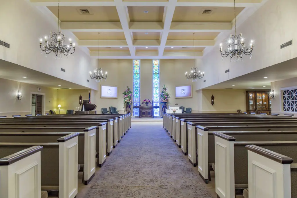 A great walkway in the chapel shows Geo. H. Lewis & Sons Funeral Directors' special difference.