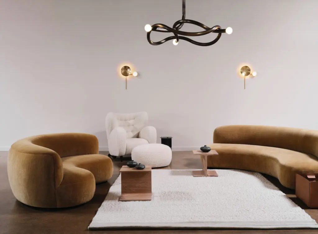 Sofa, chairs, and ottoman are Pierre
Augustin Rose, Paris. De La Espada wood side tables, Portugal. Bronze sculptures are Herma de Wit, The Netherlands. Chandelier is Paul Matter,
India. Rug by Armadillo, L.A. Giopato & Coombes sconces, Italy. (Photo by Lisa Petrole)