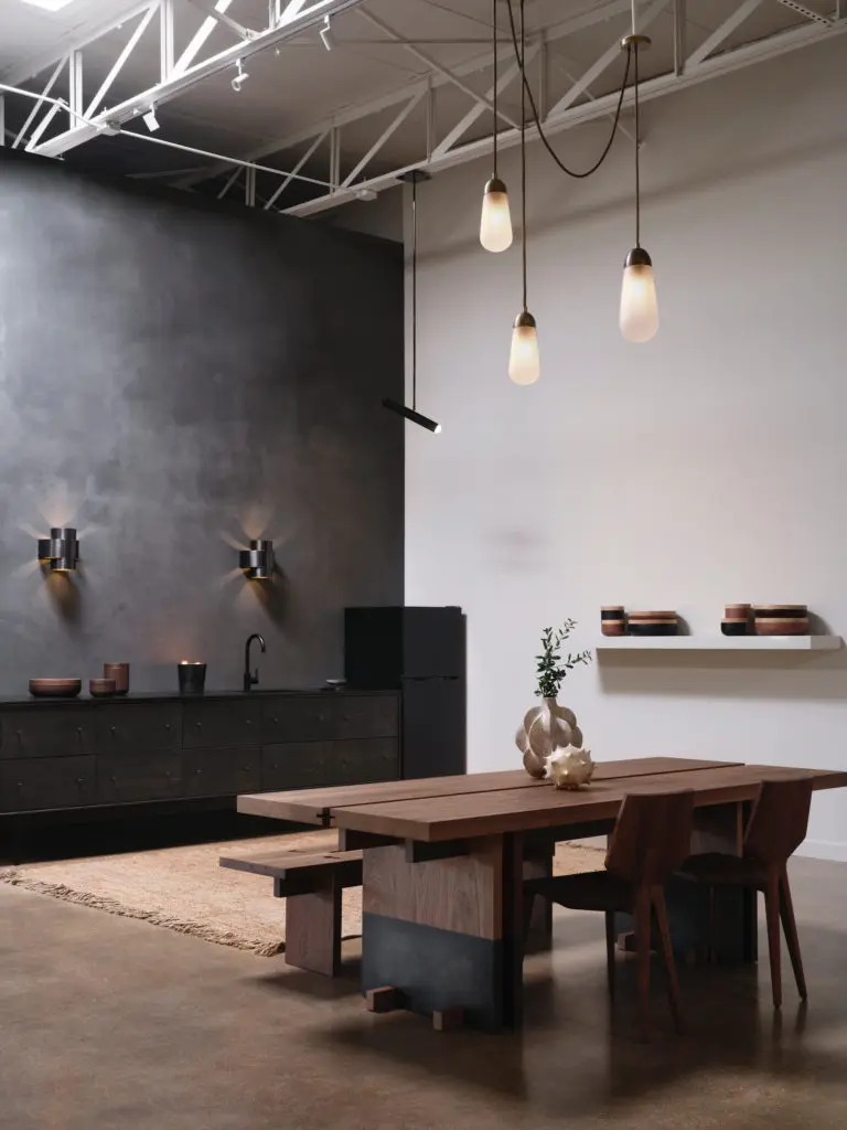 Kerstens table and benches, Belgium.
Apparatus Studio light pendant, NY. Ceramics on table are by Julie Nelson, England. Ceramics on shelf Vincent Van Duysen, Belgium. Rug by Armadillo, L.A. (Photo by Lisa Petrole)