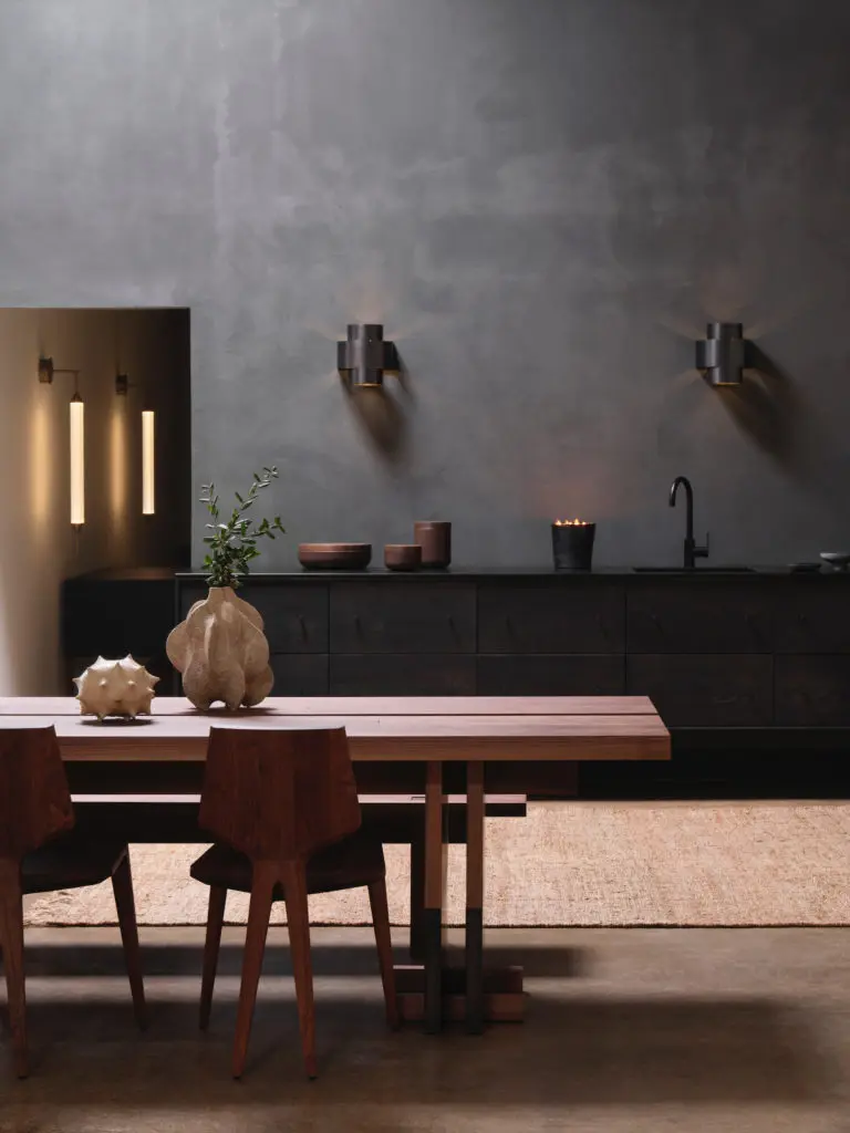 Kitchen island by Edward Collinson, London. Paul Matter sconces, Italy. (Photo by Lisa Petrole)
