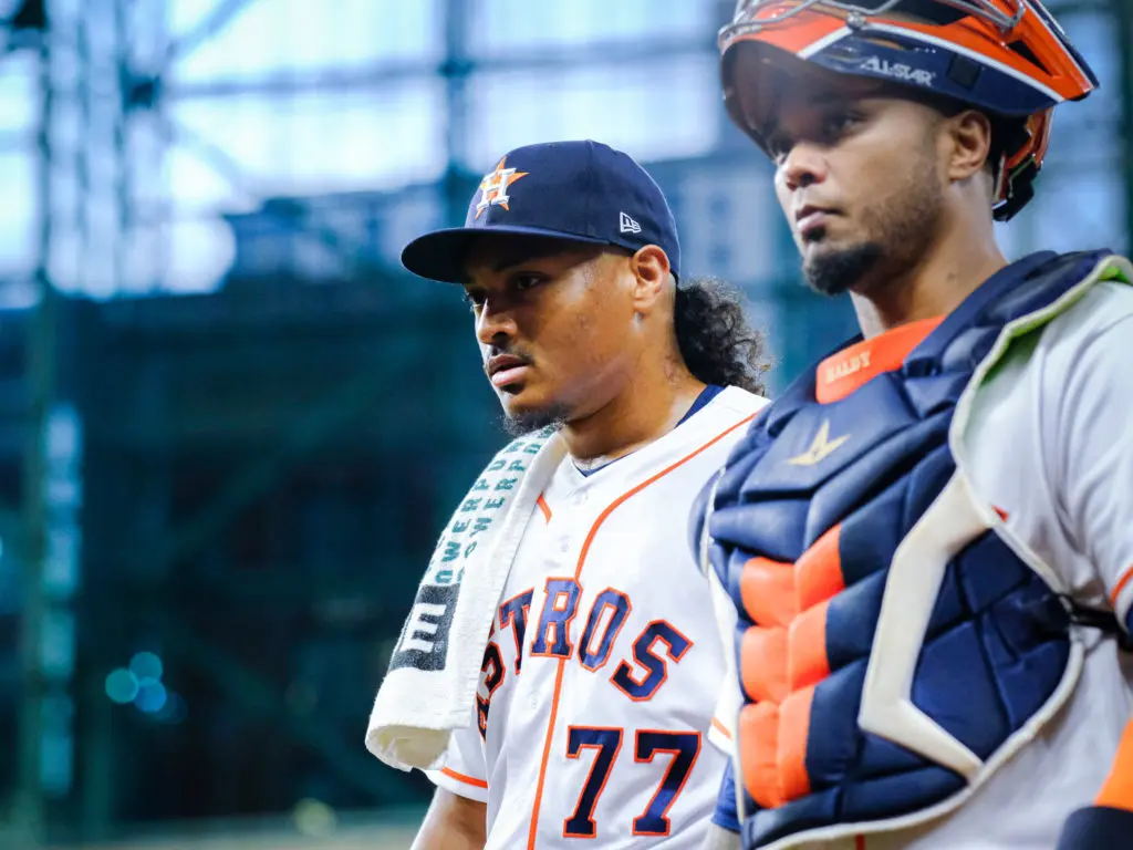 Luis Garcia and Martin Maldonado know all about going to work. (Photo by F. Carter Smith)