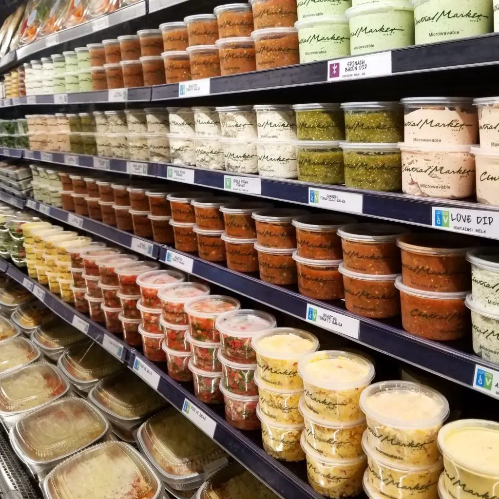 Dips and grab and go meals fill the cold cases at Central Market.