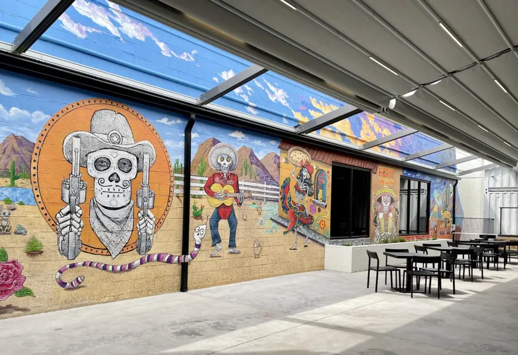 Colorful murals add to the ambience on the spacious patio. at the new Fort Brewery space. (Photo by Courtney Dabney)