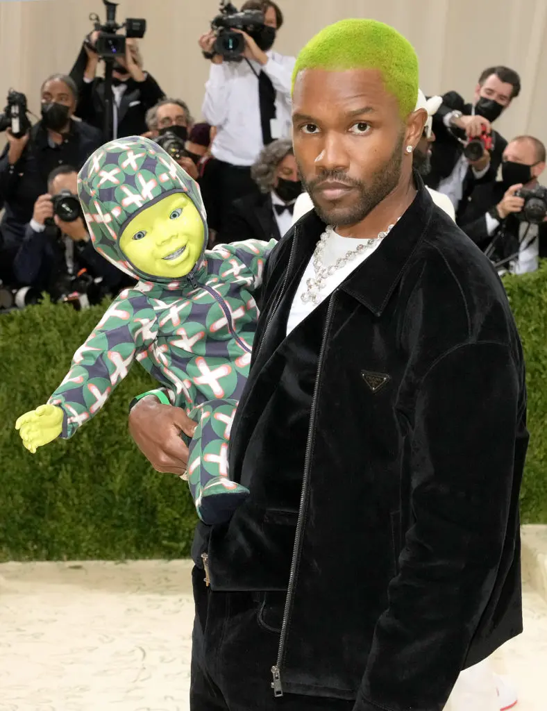 Frank Ocean wears a Prada black velvet jacket, vest and denim pants with a white stretch cotton T-shirt.
(Photo by Jeff Kravitz/FilmMagic)
